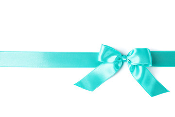 Turquoise ribbon with bow isolated on white background. Gift concept