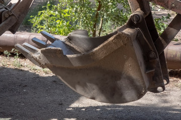 bucket excavator standing on the street