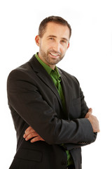 handsome businessman standing in a suit and smiles