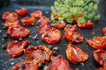 Tomatoes dried on baking tray. Preparation dried tomatoes