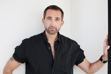 Fototapeta premium handsome bearded man standing with open black shirt