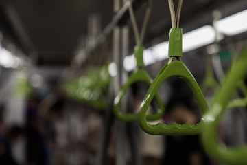 Close up of hand handlers inside the metro of Singapore