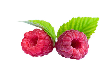 Ripe raspberry with green leaves isolated on white background. Isolated raspberry. Two fresh...