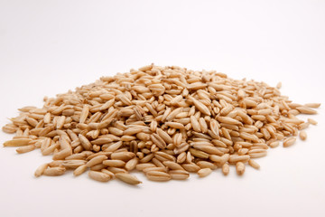 Fresh oats over white full as background