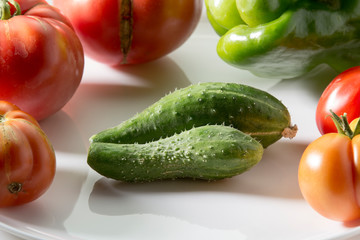 Ugly freak organic cucumber on a white background. The concept of organic vegetables.