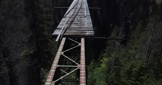 Tilt Up Cinematic Aerial of Vance Creek Bridge, Abandoned and Unsafe Landmark in Washington State, USA