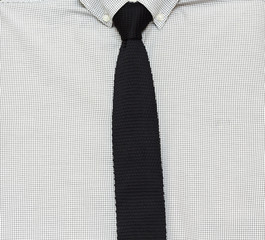 gray shirt and knit tie