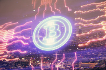 Multi exposure of cryptocurrency theme hologram drawing and city veiw background. Concept of blockchain and bitcoin.