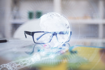 Map hologram with glasses on the table background. Concept of globalization. Double exposure.