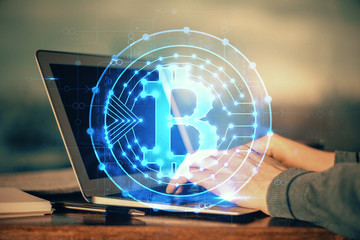 Blockchain theme hud with businessman working on computer on background. Concept of crypto chain. Double exposure.