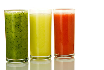 Fresh cocktail on isolate. Three glasses with vegetable cocktails. Healthy drinks.