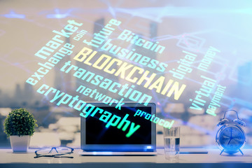 Double exposure of blockchain and crypto economy theme hologram and table with computer background. Concept of bitcoin cryptocurrency.