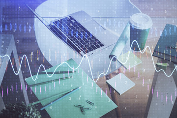 Double exposure of chart and financial info and work space with computer background. Concept of international online trading.