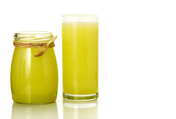 Fresh cocktail on isolate. A glass and a can with vegetable cocktails. Healthy drinks.