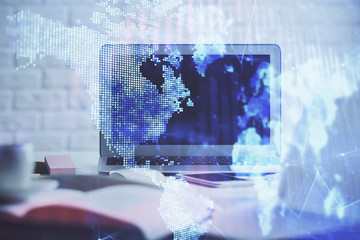 Stock market graph and table with computer background. Double exposure. Concept of financial analysis.