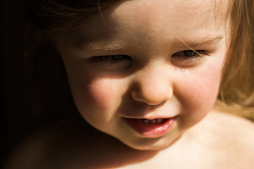 Toddler child girl close shot in sun light