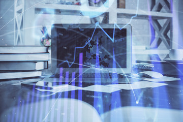 Forex market chart hologram and personal computer background. Multi exposure. Concept of investment.