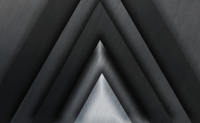 Abstract illustration. Frame filled with gray triangles of different shades with steel surface and drop shadows.