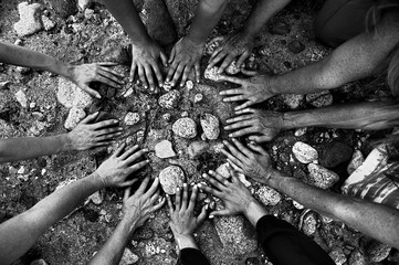 Women's gathering hands all coming together in a circle in nature.. - 283091023