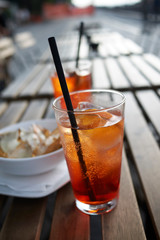 Spritz cocktail with nachos chips