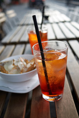 Spritz cocktail with nachos chips