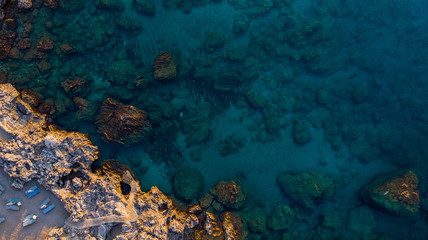 Obraz premium Secret Beach on Rocky Shore and Blue Waters, Greek Island, Drone View