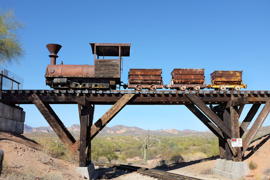 APACHE JUNCTION, ARIZONA - DECEMBER 8, 2016: Ore Cars on trestle at the Goldfield Ghost Town, in Apache Junction, Arizona, off of Route 88.
