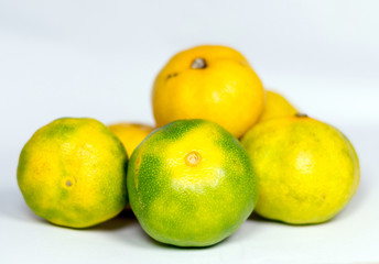 Fresh juicy clementine mandarins isolated on white
