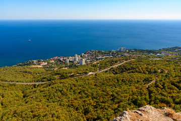 Fototapeta na wymiar view of the Black Sea city of Foros from the height of the mountain, on a bright sunny cloudless day.