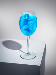Exquisite blue cocktail with ice-cubes