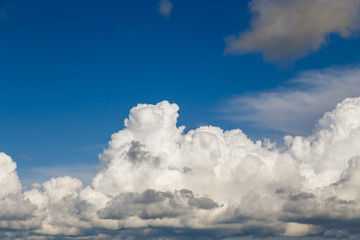Cumulus clouds against the blue sky
