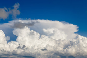Cumulus clouds against the blue sky