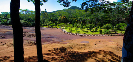 MAURITIUS - AUGUST 21, 2018: People in a sunny day walking across the Chamarel-seven-color park, Mauritius