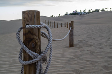 Trunks with ropes in the sand