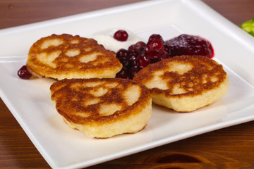 Pancakes with jam and berries