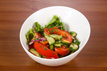 Vegetable salad with tomato, cucumbers