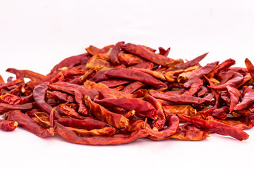 Fototapeta premium Dried red chili or chilli cayenne pepper isolated on white background
