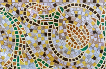 Ceramic tile mosaic with floral ornament. Background and texture of ceramic tiles mosaic.