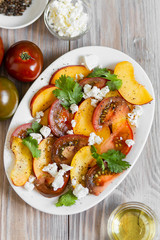 Peaches and tomatoes salad with cheese