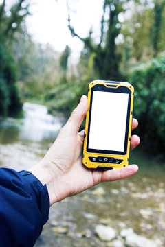 Sports extreme shockproof smartphone in hand