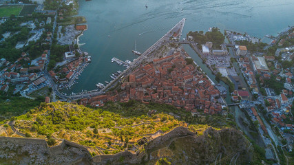 Panoramic aerial view of the red tiled roofs of the old town of Kotor and Kotor Bay in Montenegro