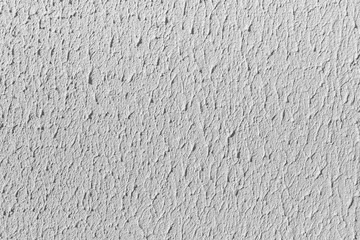Fototapeta premium Beautiful horizontal texture of part of old concrete wall painted in gray and white color and with holes on the photo