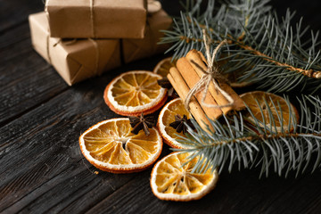 Wooden table with Christmas decorations, dried orange slices