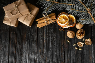 christmas spirit fragrant spices anise and cinnamon lie on a wooden table, dry slices of orange