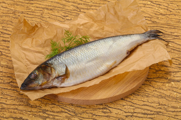 Salted herring over the wooden board