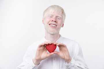 portrait of an albino man in  studio dressed t-shirt isolated on a white background. abnormal deviations. unusual appearance