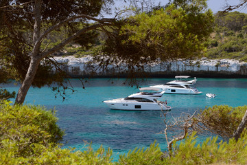 white motor yachts in a beautiful sea lagoon