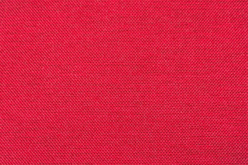 Obraz premium Rough red fabric texture for background and design. Soft focus