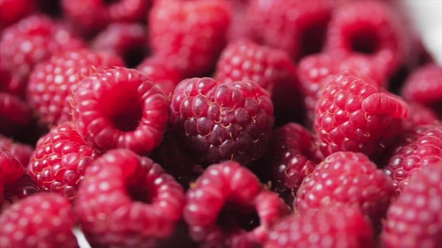 Close Up Rotation Loopable Berry. Fresh, Juicy Raspberry Background, Ripe. Macro Red Raspberries Fruit. Fresh Raspberry Fruits As Food Dackground. Healthy Food Organic Nutrition.