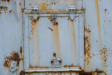 rusty iron square door in a car van